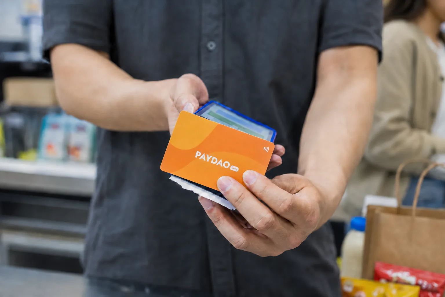 Paying with a PAYDAO card at a convenience store
